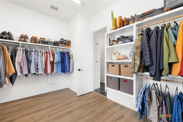 spacious closet with wood finished floors and visible vents