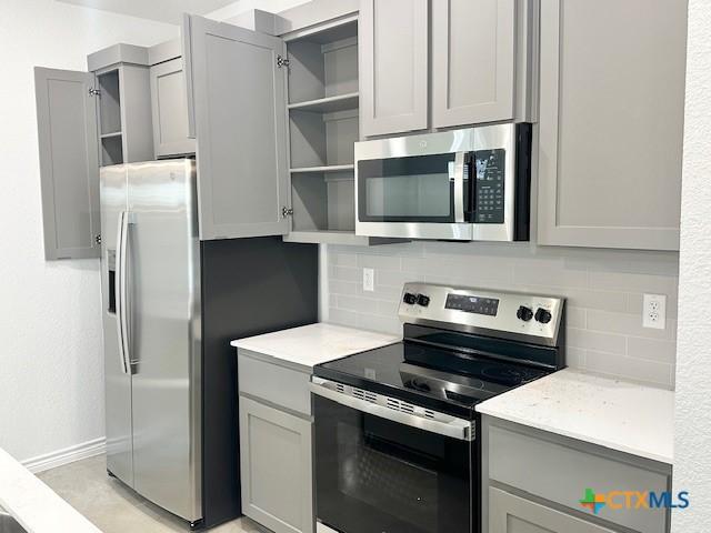 kitchen featuring sink and gray cabinetry