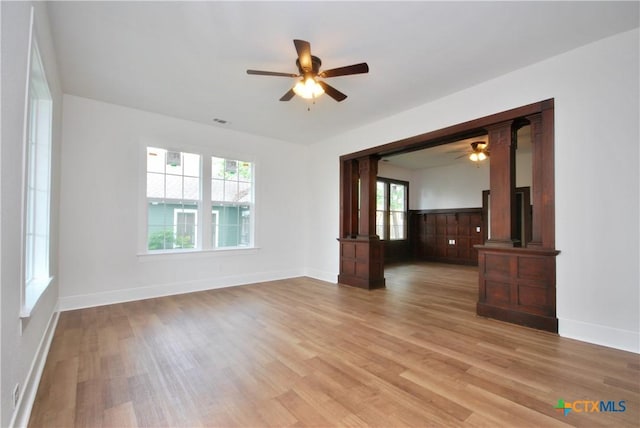 215 E Gonzales St, Yoakum, TX 77995 - empty room featuring a ceiling fan, baseboards, and light wood-style floors