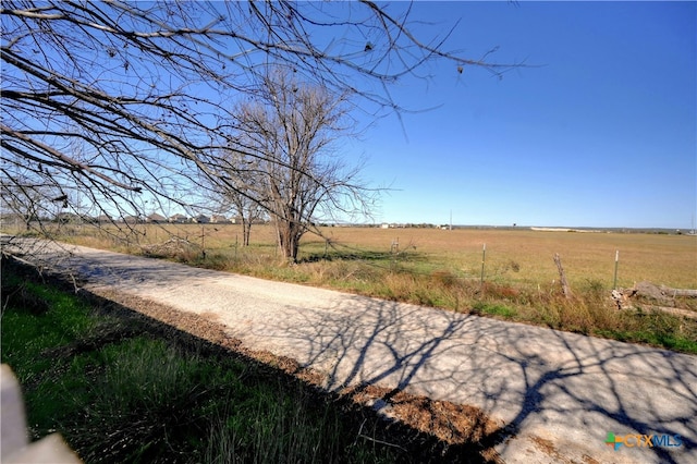 view of yard with a rural view