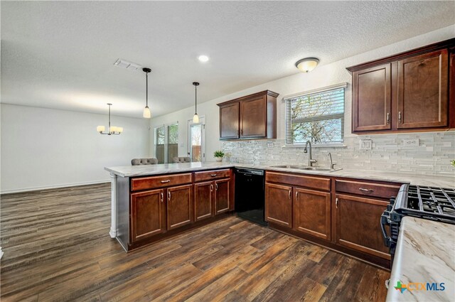 kitchen with dishwasher, sink, hanging light fixtures, dark hardwood / wood-style flooring, and kitchen peninsula