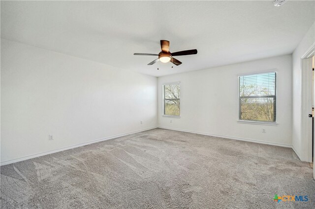 carpeted empty room with ceiling fan