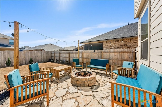 view of patio / terrace with an outdoor fire pit and a fenced backyard