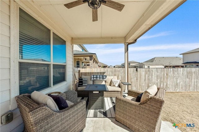 view of patio / terrace featuring fence and a ceiling fan