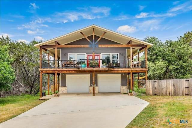 view of front of property with a garage and a front yard