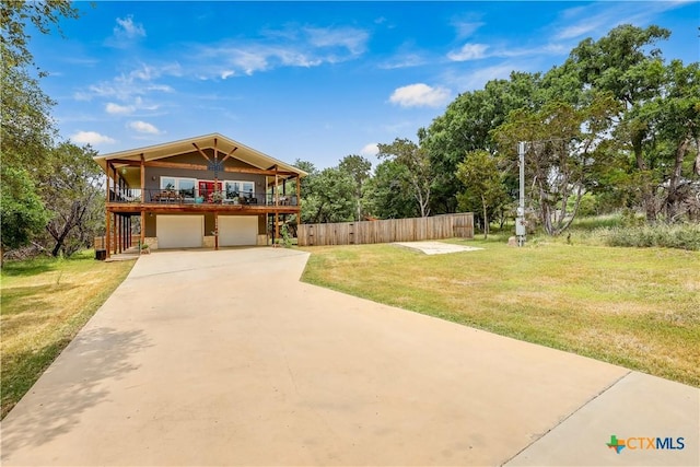 view of front of home with a garage and a front yard