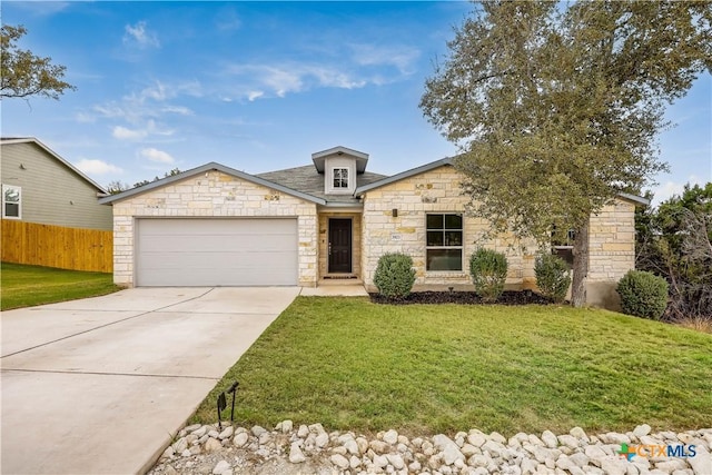 view of front facade with a garage and a front lawn