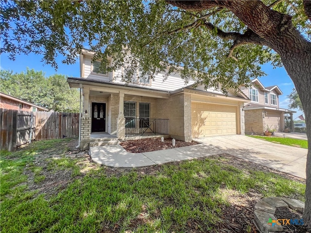 view of front of home with a garage and covered porch