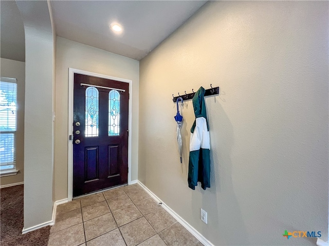 entrance foyer with light tile patterned floors