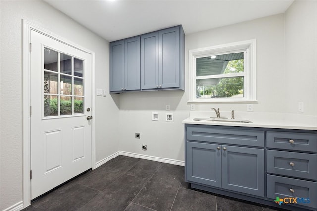 clothes washing area with sink, a healthy amount of sunlight, cabinets, washer hookup, and electric dryer hookup