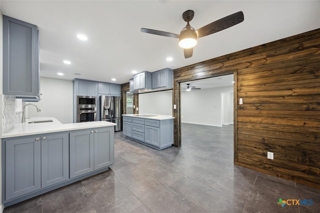 kitchen with gray cabinets, ceiling fan, sink, and appliances with stainless steel finishes