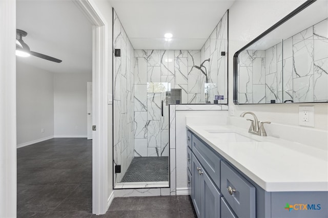 bathroom with ceiling fan, vanity, and a shower with shower door