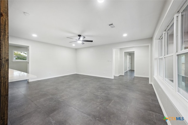 spare room with ceiling fan