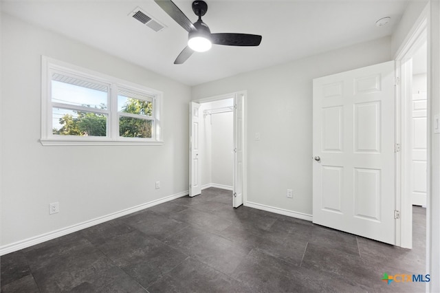 unfurnished bedroom featuring ceiling fan