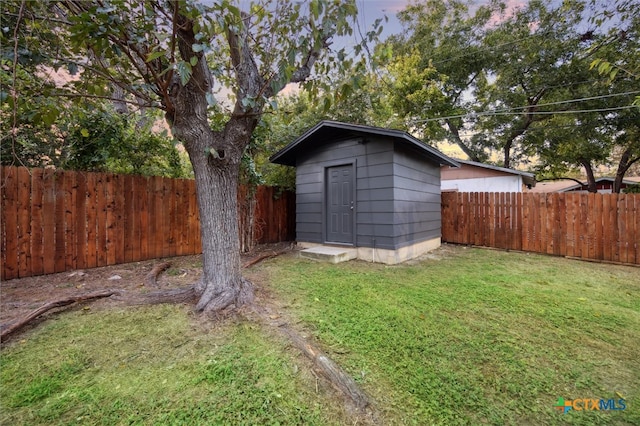 view of outdoor structure with a lawn