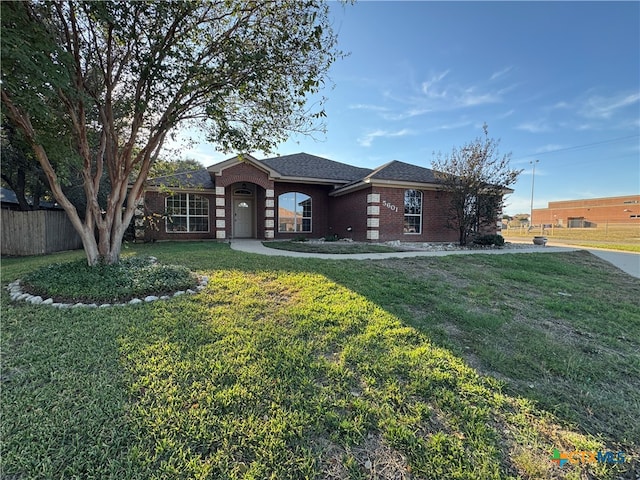 ranch-style home with a front yard