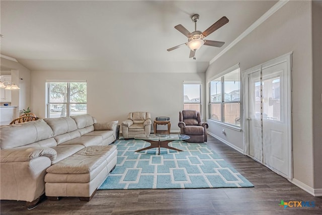 7624 Copper Creek Trl, Temple, TX 76502 - living room featuring a ceiling fan, dark wood-type flooring, crown molding, and baseboards