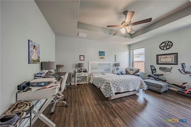 7624 Copper Creek Trl, Temple, TX 76502 - bedroom with a raised ceiling, dark wood-type flooring, and a ceiling fan