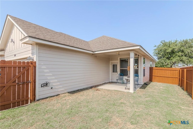 7624 Copper Creek Trl, Temple, TX 76502 - back of house with a patio, a gate, and a shingled roof