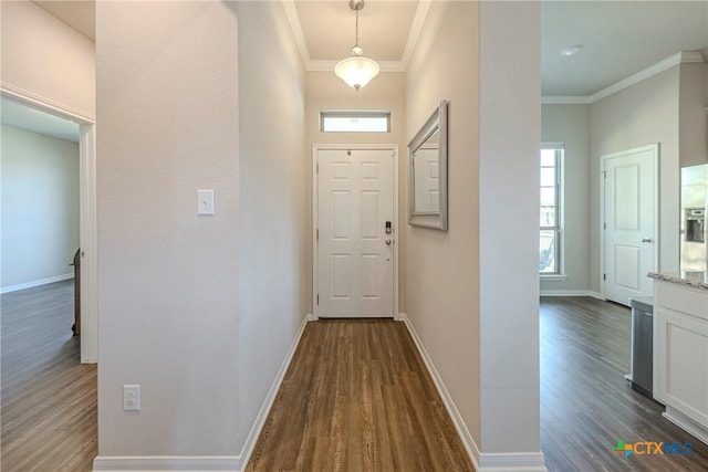 7624 Copper Creek Trl, Temple, TX 76502 - hallway with dark wood finished floors, crown molding, and baseboards