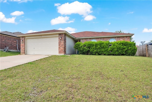 ranch-style home with a garage and a front yard