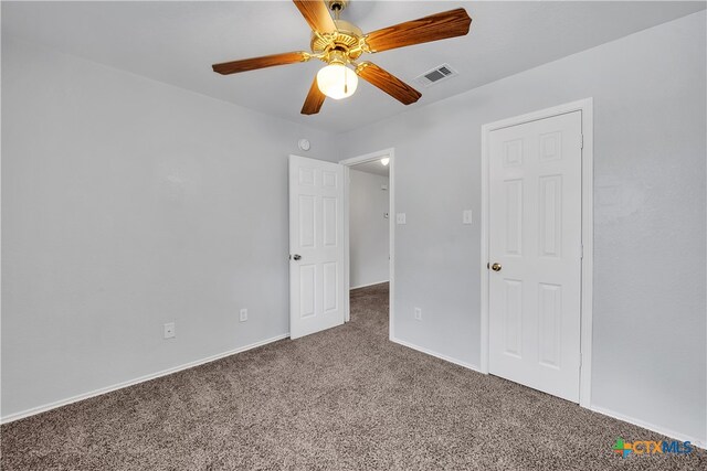 unfurnished bedroom featuring carpet floors and ceiling fan