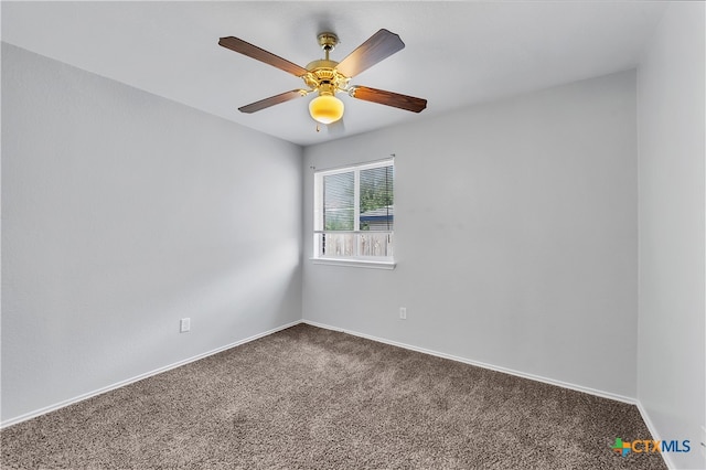 spare room with ceiling fan and carpet flooring