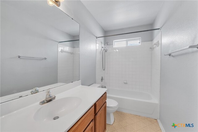 full bathroom featuring vanity, toilet, and tiled shower / bath combo