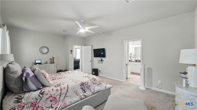 315 Lillianite, New Braunfels, TX 78130 - bedroom with light colored carpet, baseboards, ensuite bathroom, and ceiling fan