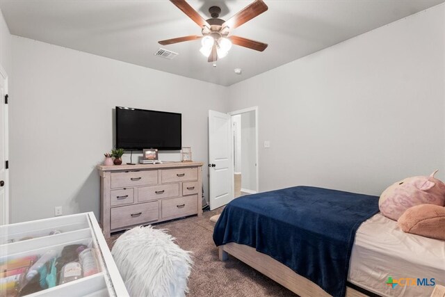 bedroom featuring light carpet and ceiling fan