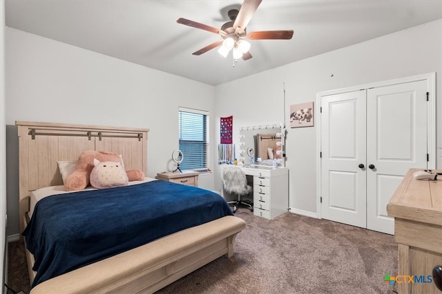 carpeted bedroom featuring ceiling fan and a closet