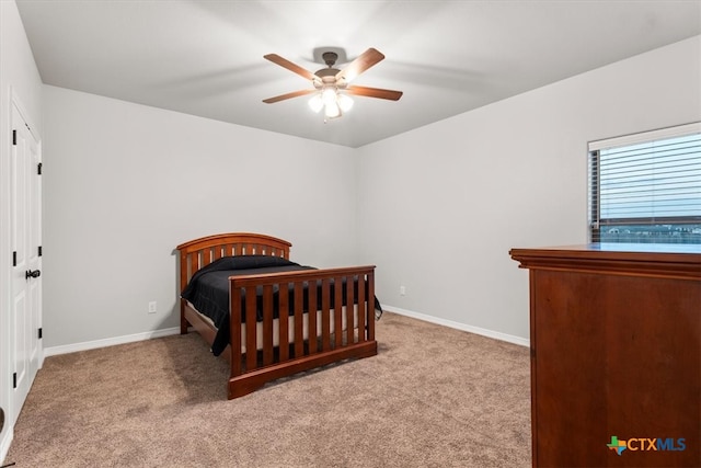 bedroom with light carpet and ceiling fan