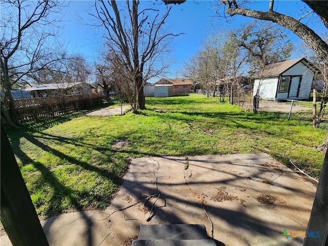 view of yard featuring a patio and fence