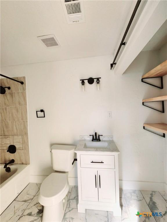 bathroom featuring marble finish floor, baseboards, and visible vents