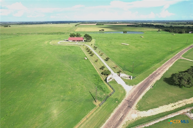 birds eye view of property with a rural view