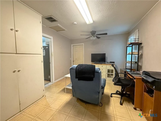 office space featuring ceiling fan and a textured ceiling