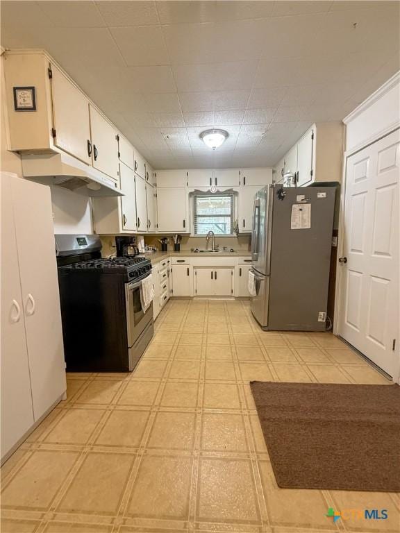 kitchen featuring white cabinets, sink, and stainless steel appliances