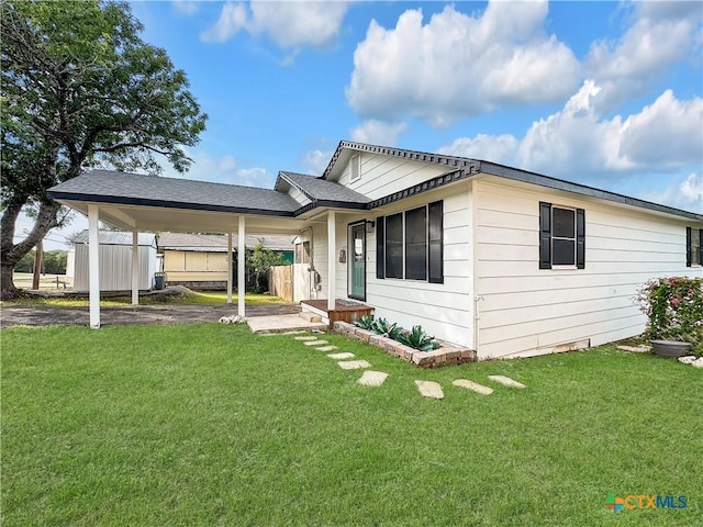 1412 Laurie Dr, Canyon Lake, TX 78133 - view of front of home with a front lawn and an attached carport