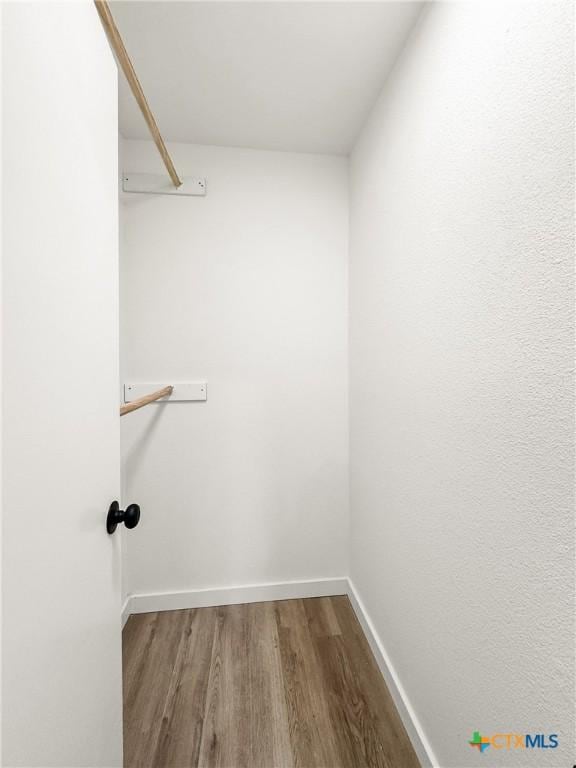 1412 Laurie Dr, Canyon Lake, TX 78133 - walk in closet with wood finished floors