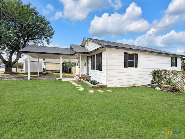 1412 Laurie Dr, Canyon Lake, TX 78133 - view of home's exterior with a lawn and an attached carport