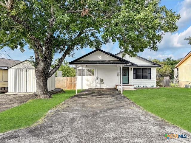 1412 Laurie Dr, Canyon Lake, TX 78133 - ranch-style house featuring driveway, an attached carport, entry steps, and cooling unit