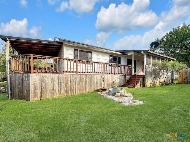 1412 Laurie Dr, Canyon Lake, TX 78133 - rear view of property with a yard and a wooden deck