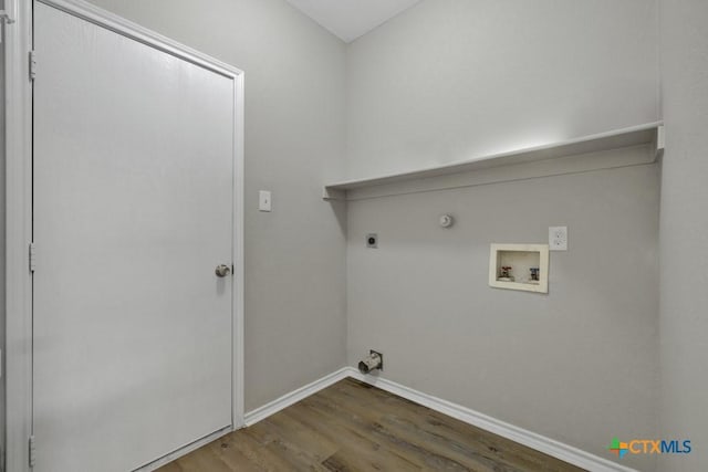 laundry area featuring electric dryer hookup, hookup for a gas dryer, washer hookup, and hardwood / wood-style flooring