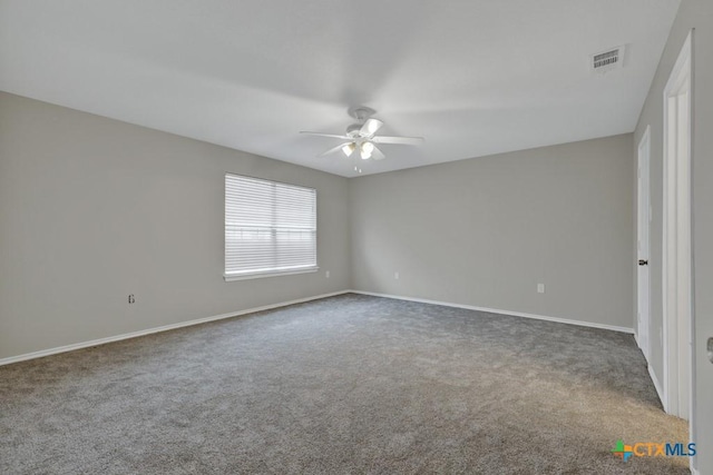 carpeted empty room featuring ceiling fan