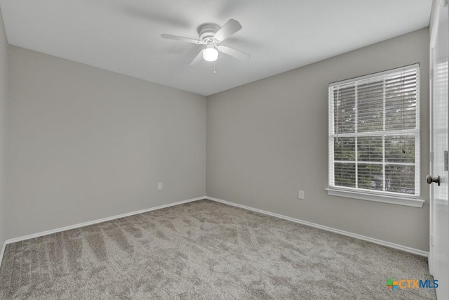 carpeted empty room with ceiling fan