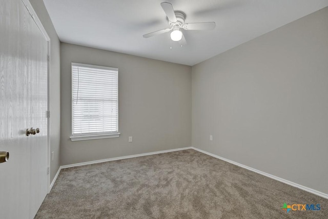 unfurnished room with ceiling fan and light colored carpet