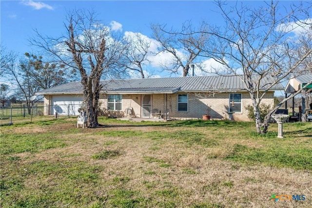 rear view of house with a yard