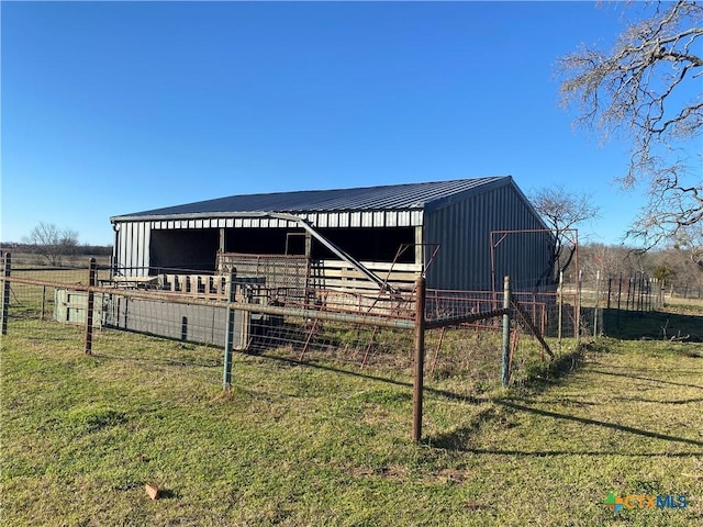 view of outdoor structure with a rural view