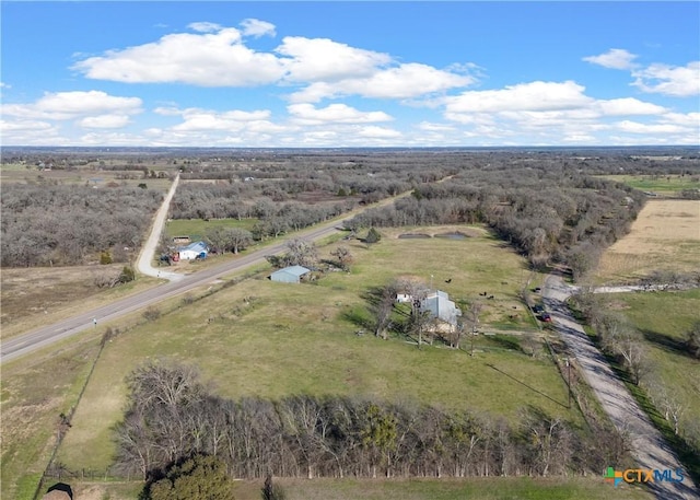 birds eye view of property featuring a rural view