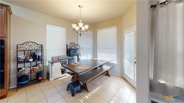 1906 Terry Dr, Copperas Cove, TX 76522 - dining room featuring a chandelier, light tile patterned floors, healthy amount of natural light, and baseboards